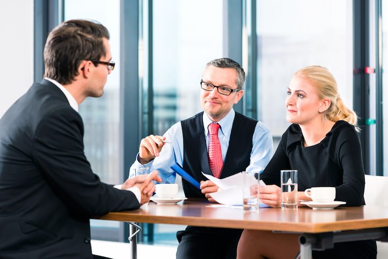 lawyers sitting at a table talking